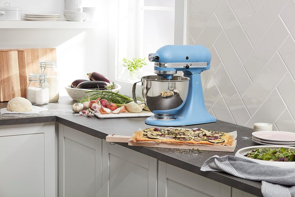 A KitchenAid Artisan stand mixer on a kitchen counter