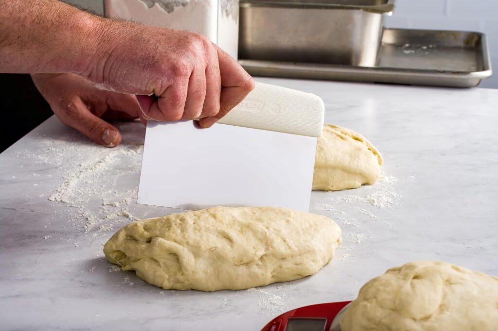 Hands working a smooth dough