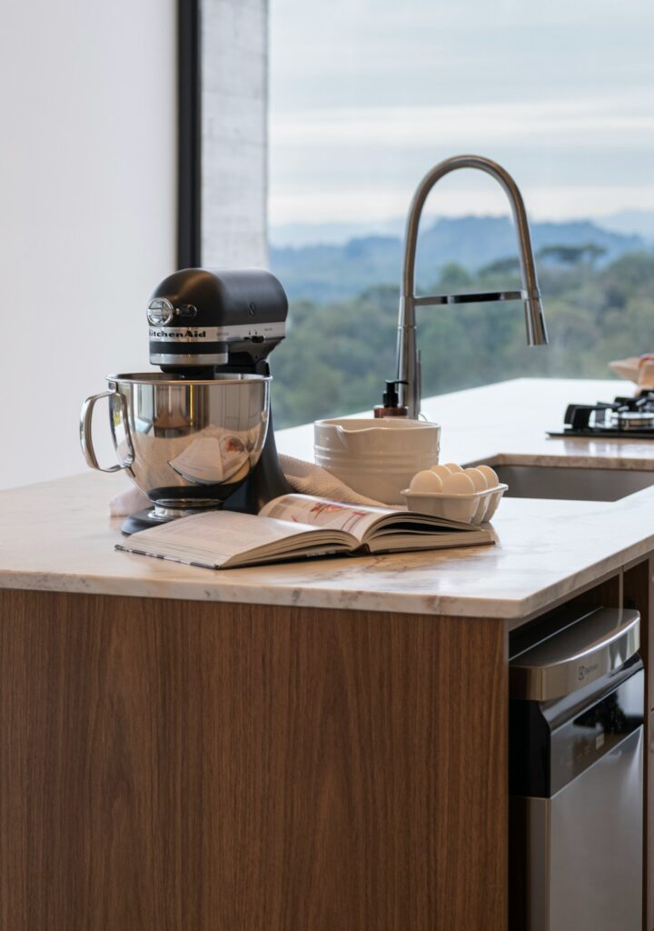 A KitchenAid Artisan stand mixer on a kitchen counter